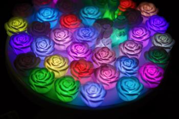 Abstract lights. Multicolored glowing lanterns in the form of flowers roses and angels. Shallow depth of field. Selective focus.