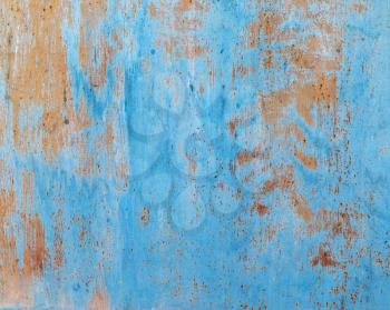 Peeling paint and rust stains background. Old blue grunge texture.