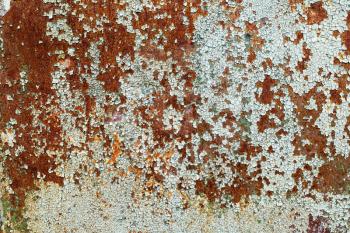 Rusty metal texture with cracked paint. Old peeling paint with cracks and rust spots. Vintage background.