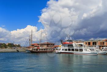 Nesebar, Bulgaria - September 06, 2013: Ships and boats in the port of the old town Nessebar on the bulgarian Black Sea coast. Sunny summer day. UNESCO world heritage site.