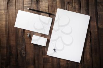 Photo of blank corporate identity. Stationery set. Branding mockup. Sheets of paper, letterhead, business cards, envelope and pencil.