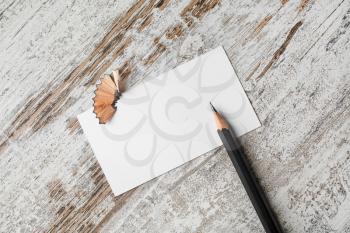 Bank business card and pencil on vintage wooden table background.