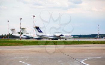 Minsk, Belarus - August 30, 2014: Passenger planes on the runway of the airport Minsk 2. Arplanes at the airport. Selective focus.