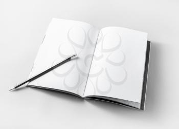 Blank opened book and pencil on paper background. Template for placing your design. Responsive design mockup.