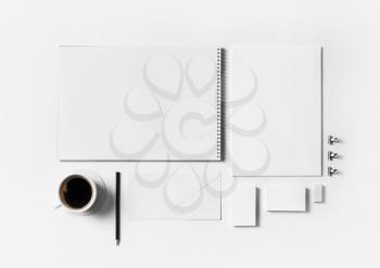 Blank corporate stationery template on white paper background. Top view. Flat lay.