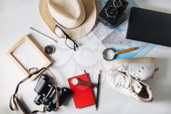 Travel plan background. Vacation items and outfit of traveler. Flat lay.