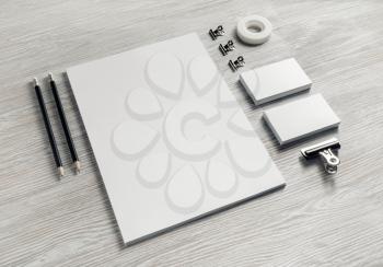 Blank stationery set on light wood table background. Corporate identity template. Responsive design mockup.