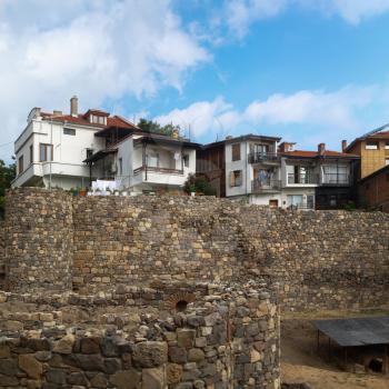 Sozopol, Bulgaria - September 03, 2014: Remains of stone fortress wall and houses. View of the old town Sozopol in Bulgaria.
