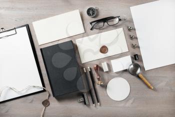 Photo of blank retro stationery on wooden background. Branding mock up. Flat lay.