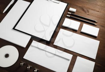 Blank business stationery set on wooden background.
