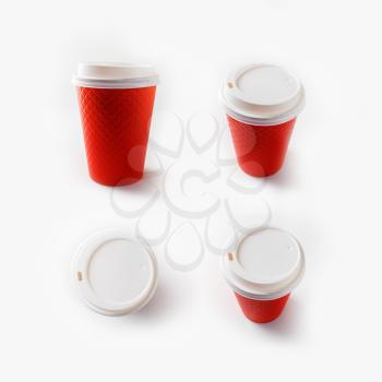 Disposable red paper coffee cups. Package for drinks.