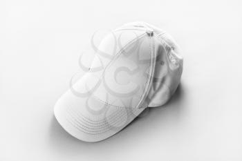 Blank baseball cap on paper background. Responsive design mockup.