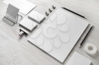 Blank white stationery set. Business brand template on light wood table background.