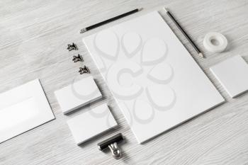 Blank stationery and corporate identity template on light wooden background. Responsive design mockup.