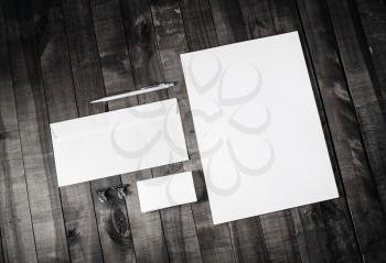 Corporate stationery set. Blank branding identity template on wood background. Top view.