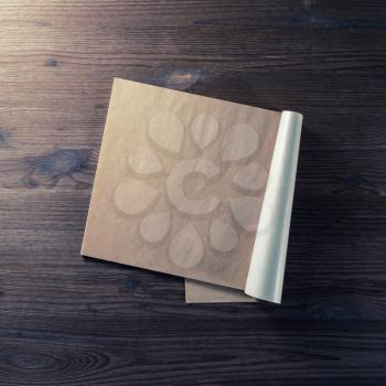 Notebook or booklet with blank pages on wooden background. Top view. Flat lay.