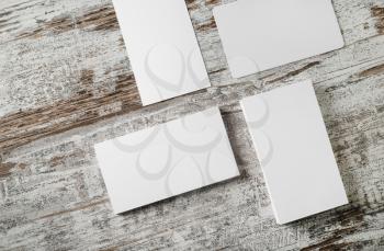 Blank business cards template on vintage wood table background. Mockup for branding identity for designers.