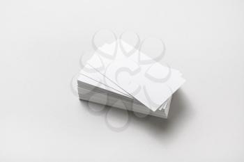 Blank business cards stack at white paper background. Corporate stationery set mockup.