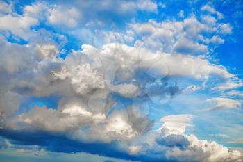 Sky with voluminous cumulus clouds. Natural background.