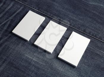 Three blank name cards on denim background. Business cards template. Copy space for text.