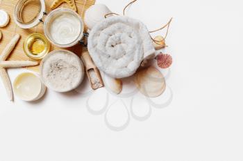 Beauty and spa wellness products and toiletries on white paper background. Space for text. Flat lay.