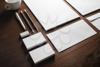 Photo of blank stationery set on wooden background. Corporate identity mock up for placing your design.