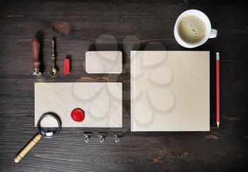 Retro stationery template on wood table background. Mock up for branding identity. Top view. Flat lay.
