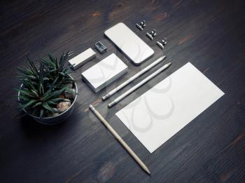 Photo of blank stationery set on wooden background. Blank stationery template for branding identity for designers.