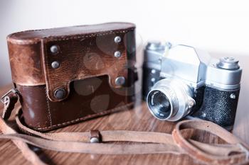 Vintage rangefinder camera with leather cover case background