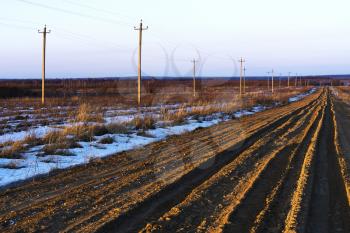 Russian countryside offroad with power lines background