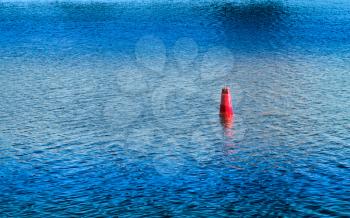 Vivid red buoy on river surface background hd