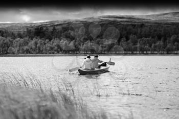 Black and white couple of tourists swimming in boat background hd