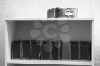 Black and white toy cases on the shelf background hd
