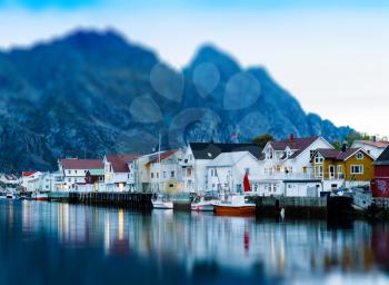 Horizontal vivid Norway town mountain pier reflections lights background backdrop