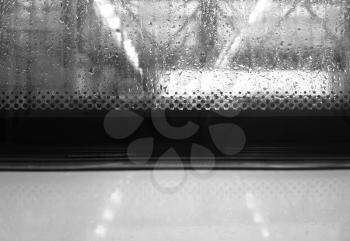 Black and white rainy trolley window background
