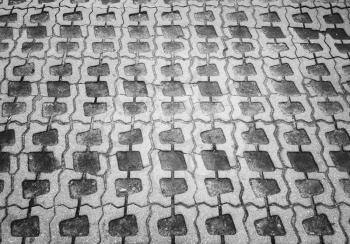 Diagonal black and white pavement texture background