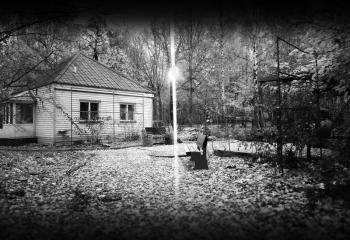 Cabin in autumn park with light lamp background