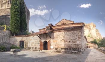 Panoramic view of the Assumption of Virgin Mary byzantine church in Meteora, Kalambaka town in Greece, on a sunny summer day