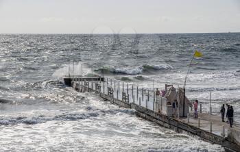 Odessa, Ukraine - 09.05.2019. Stormy sea in the resort of Arcadia in Odessa, Ukraine, on an cloudy autumn day.