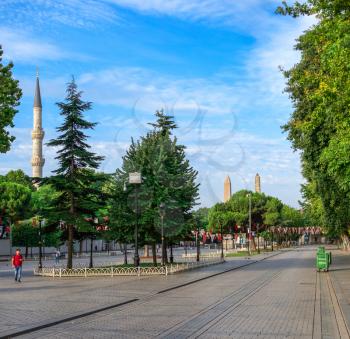 Istambul, Turkey – 07.13.2019. Many tourists walk around Sultan Ahmet Park on the site of a former Hippodrome in Istanbul, Turkey, on a sunny summer morning