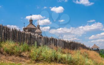 Zaporozhye, Ukraine 07.20.2020. External walls, wooden fence and watchtowers of the National Reserve Khortytsia in Zaporozhye, Ukraine, on a sunny summer day