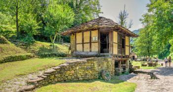 Water mill in the Etar Architectural Ethnographic Complex in Bulgaria on a sunny summer day. Big size panoramic photo.