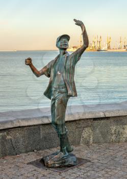 Berdyansk, Ukraine 07.23.2020. Monument to the fisherman on the embankment of Berdyansk, Ukraine, on an early summer morning