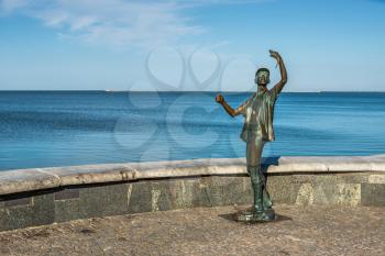 Berdyansk, Ukraine 07.23.2020. Monument to the fisherman on the embankment of Berdyansk, Ukraine, on a sunny summer morning