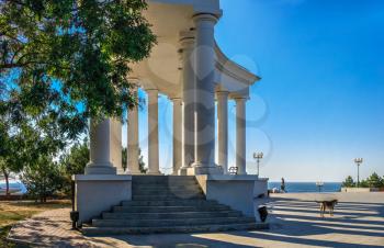 Chernomorsk, Ukraine 08.22.2020. Colonnade and Obelisk of Glory in Chernomorsk city on a sunny summer morning