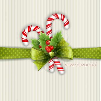 Christmas decoration with holly leaves and green polka dot bow