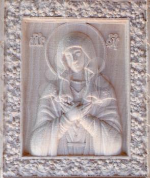 Carving on the machine with numerical control. Cut cutter machine icon of the Virgin Mary.