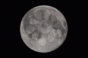 The moon in the night sky. Two thirds of the moon.