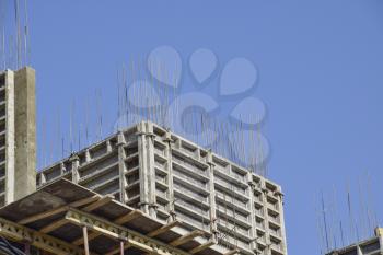 Construction of a multistory building. Installation of the concrete walls of the building.