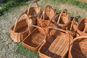 Several wicker baskets on the ground. Wickerwork handmade.